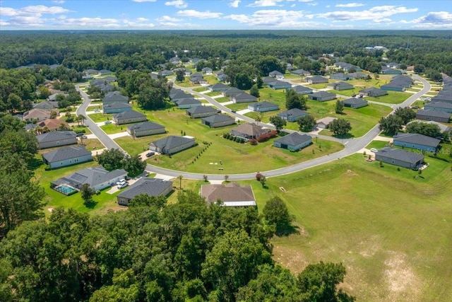 19583 SW 77th Loop, Dunnellon, FL 34432 - aerial view of property's location with nearby suburban area and a heavily wooded area