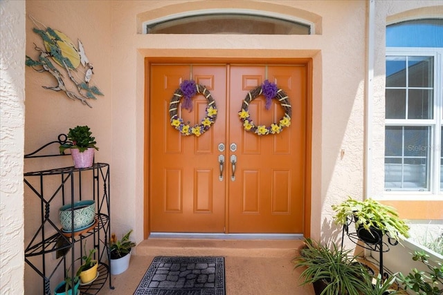 19583 SW 77th Loop, Dunnellon, FL 34432 - doorway to property with stucco siding