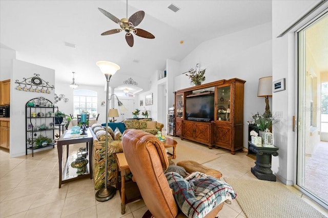19583 SW 77th Loop, Dunnellon, FL 34432 - living area featuring a ceiling fan, light tile patterned floors, and high vaulted ceiling