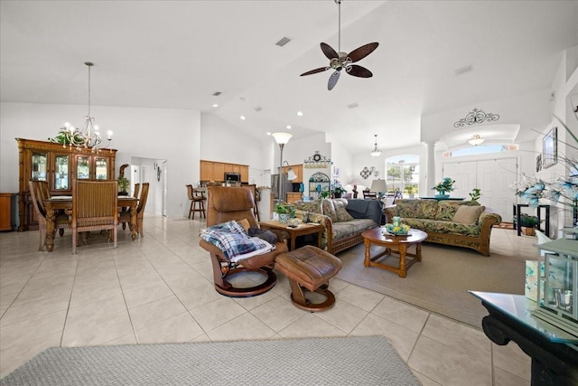 19583 SW 77th Loop, Dunnellon, FL 34432 - living room featuring a ceiling fan, ornate columns, high vaulted ceiling, and light tile patterned floors