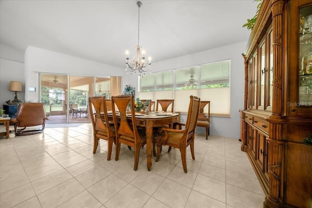 19583 SW 77th Loop, Dunnellon, FL 34432 - dining room with lofted ceiling, a chandelier, and light tile patterned flooring
