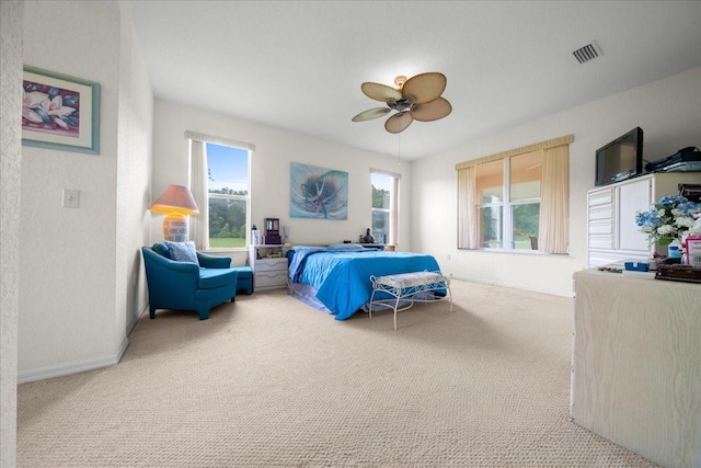 19583 SW 77th Loop, Dunnellon, FL 34432 - bedroom with carpet floors, a ceiling fan, and a textured wall
