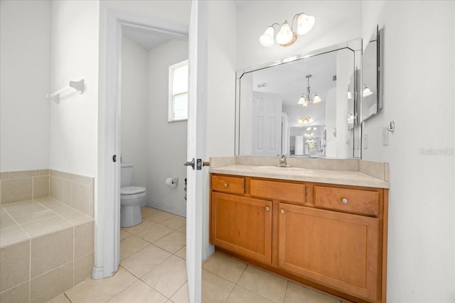 19583 SW 77th Loop, Dunnellon, FL 34432 - bathroom with vanity, a chandelier, and tile patterned flooring