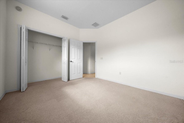 19583 SW 77th Loop, Dunnellon, FL 34432 - unfurnished bedroom with light carpet and a closet