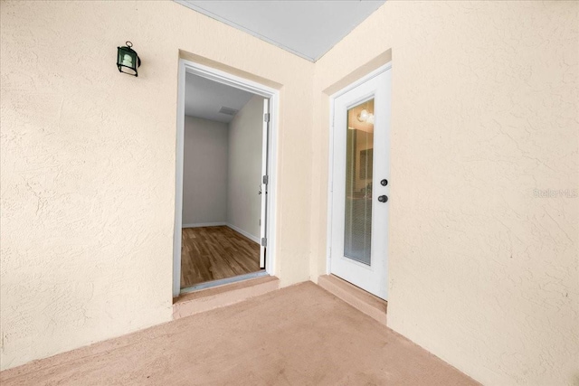 19583 SW 77th Loop, Dunnellon, FL 34432 - view of exterior entry featuring stucco siding
