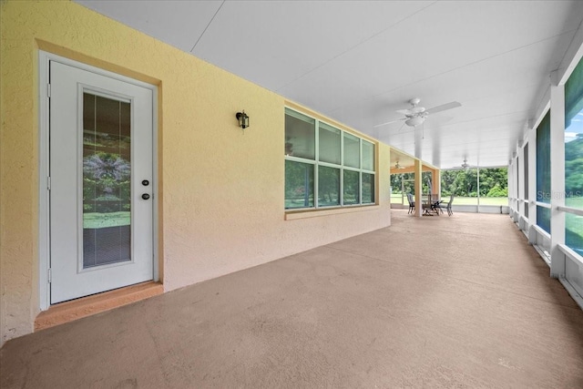19583 SW 77th Loop, Dunnellon, FL 34432 - unfurnished sunroom featuring a ceiling fan