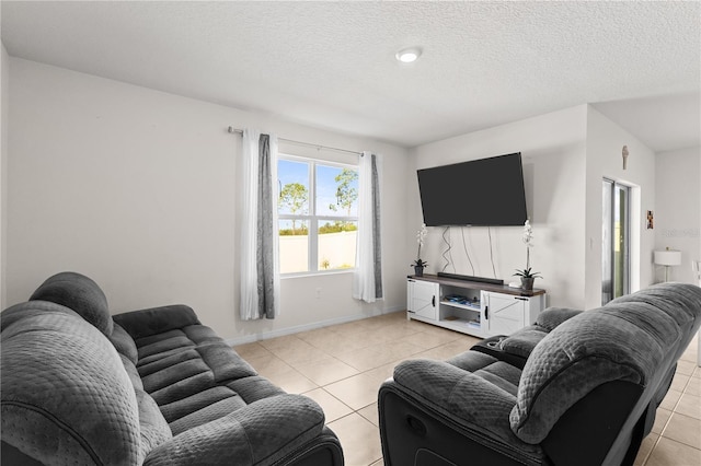 547 Tanaro Ln, Haines City, FL 33844 - living area featuring light tile patterned flooring and a textured ceiling
