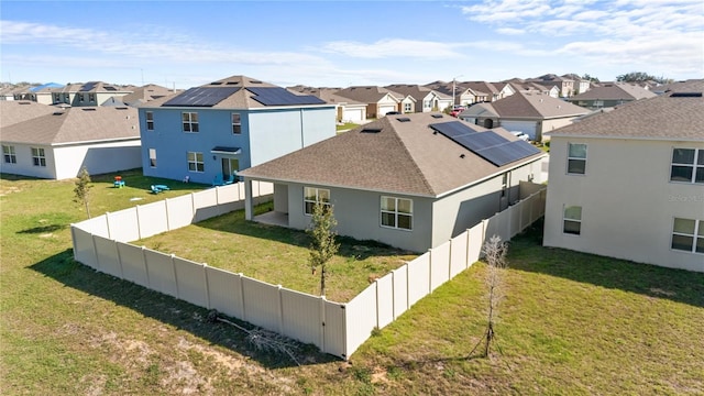 547 Tanaro Ln, Haines City, FL 33844 - view of home's exterior featuring a residential view, a fenced backyard, stucco siding, and a shingled roof