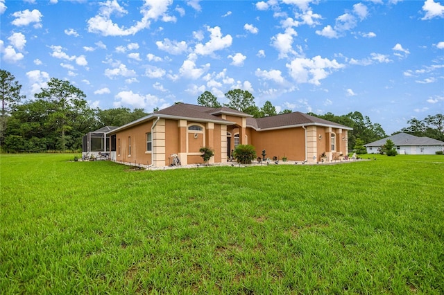 2587 W Angola Dr, Beverly Hills, FL 34465 - single story home with stucco siding, a front yard, and a lanai