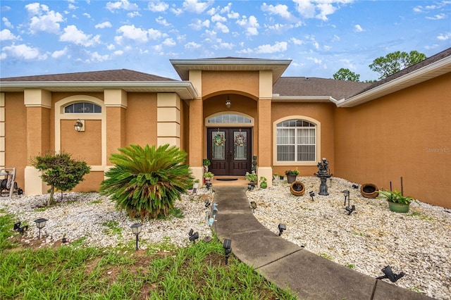 2587 W Angola Dr, Beverly Hills, FL 34465 - doorway to property with french doors and stucco siding