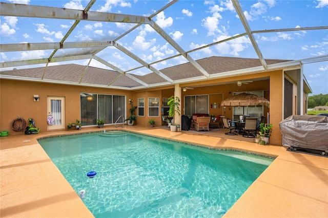 2587 W Angola Dr, Beverly Hills, FL 34465 - swimming pool with ceiling fan, a patio, outdoor dining space, a lanai, and a grill