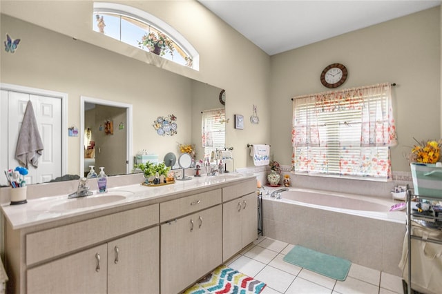 2587 W Angola Dr, Beverly Hills, FL 34465 - full bathroom featuring a garden tub, tile patterned floors, and double vanity