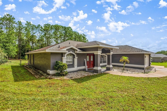 2685 W Apricot Dr, Beverly Hills, FL 34465 - view of front of property with stucco siding, an attached garage, a front lawn, and driveway