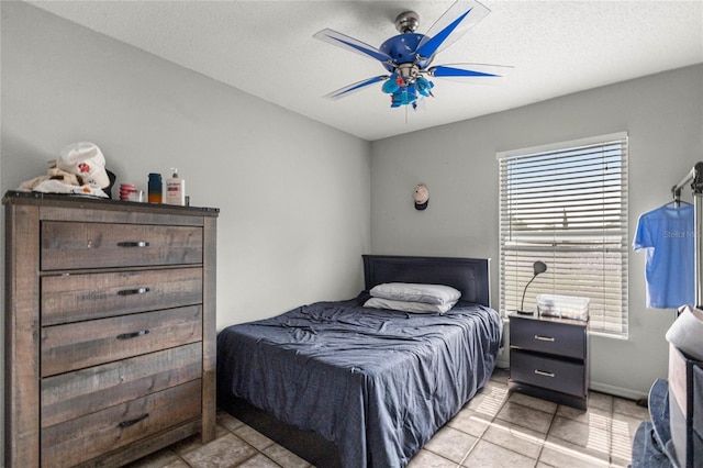 2685 W Apricot Dr, Beverly Hills, FL 34465 - bedroom featuring light tile patterned floors, ceiling fan, and a textured ceiling