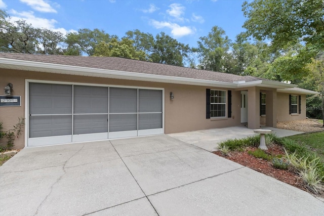 2105 E Dearborn Dr, Hernando, FL 34442 - ranch-style home with stucco siding, driveway, a garage, and a shingled roof