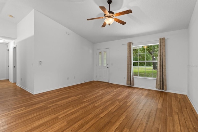 2105 E Dearborn Dr, Hernando, FL 34442 - unfurnished living room with light wood-style floors, vaulted ceiling, and ceiling fan