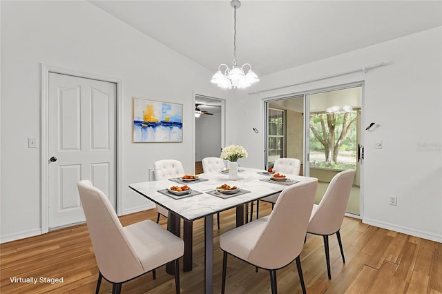 2105 E Dearborn Dr, Hernando, FL 34442 - dining room with a chandelier, light wood finished floors, and lofted ceiling