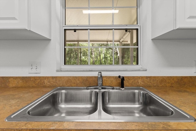 2105 E Dearborn Dr, Hernando, FL 34442 - kitchen view of white cabinetry and dark countertops