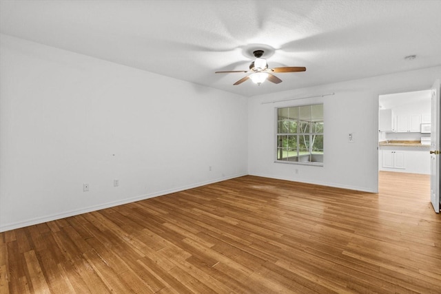 2105 E Dearborn Dr, Hernando, FL 34442 - empty room with a ceiling fan, light wood-style flooring, and a smoke detector