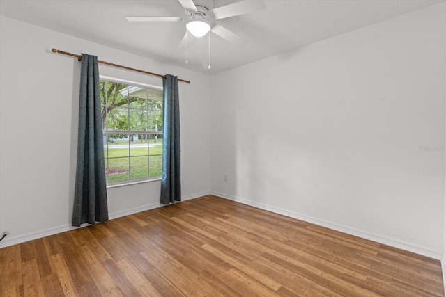2105 E Dearborn Dr, Hernando, FL 34442 - unfurnished room featuring wood finished floors and a ceiling fan