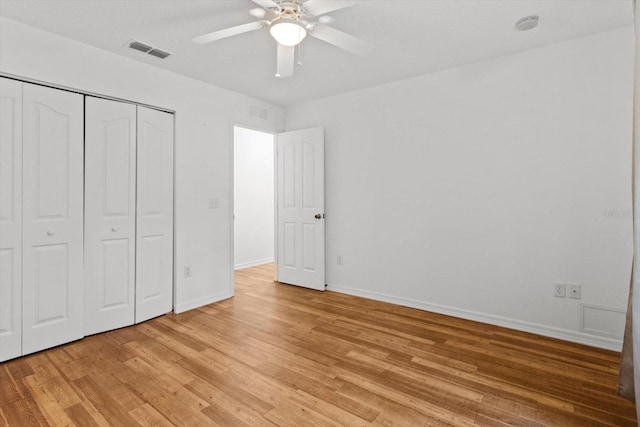 2105 E Dearborn Dr, Hernando, FL 34442 - unfurnished bedroom with light wood finished floors, a closet, and ceiling fan