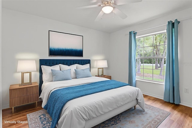 2105 E Dearborn Dr, Hernando, FL 34442 - bedroom with multiple windows, wood finished floors, and ceiling fan