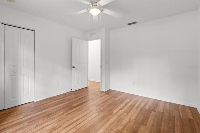 2105 E Dearborn Dr, Hernando, FL 34442 - unfurnished bedroom with light wood-style flooring, a closet, and ceiling fan