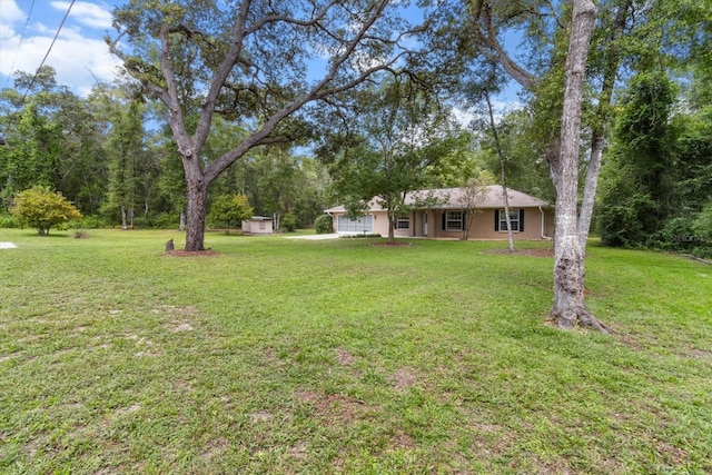 2105 E Dearborn Dr, Hernando, FL 34442 - view of grassy yard with a garage and a shed