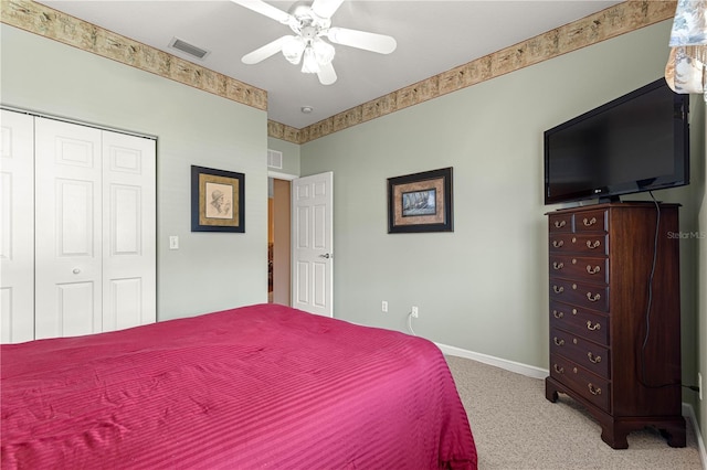 5543 NW 25th Loop, Ocala, FL 34482 - bedroom featuring light colored carpet, a closet, and a ceiling fan