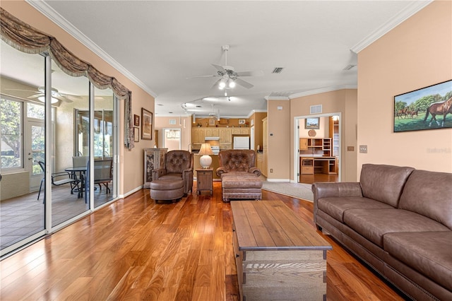5543 NW 25th Loop, Ocala, FL 34482 - living area featuring ceiling fan, light wood-style flooring, and crown molding