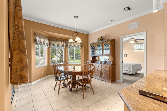 5543 NW 25th Loop, Ocala, FL 34482 - dining area with light tile patterned floors and ornamental molding