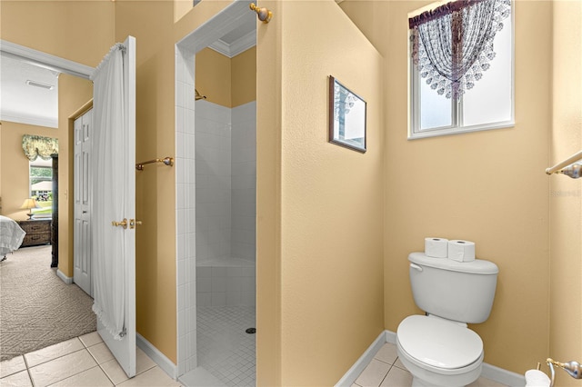 5543 NW 25th Loop, Ocala, FL 34482 - bathroom with tiled shower, tile patterned floors, and ensuite bathroom