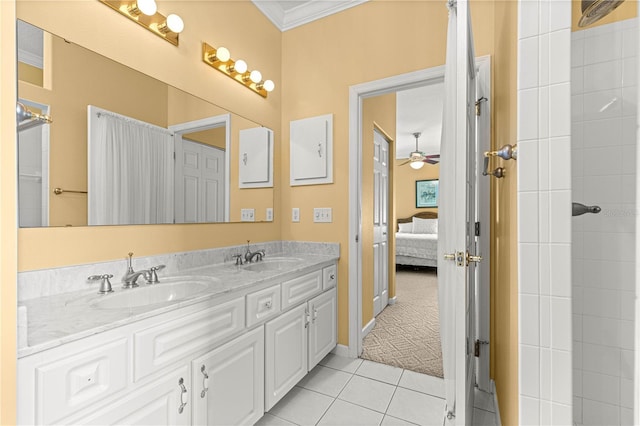 5543 NW 25th Loop, Ocala, FL 34482 - ensuite bathroom with double vanity, tile patterned floors, ornamental molding, and a ceiling fan