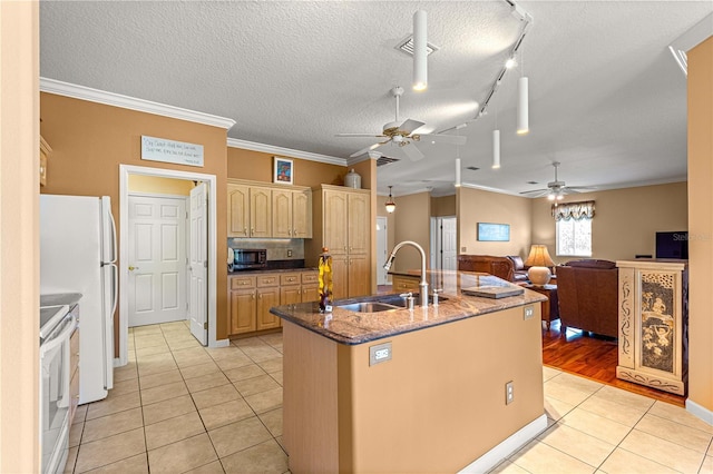 5543 NW 25th Loop, Ocala, FL 34482 - kitchen featuring a ceiling fan, white appliances, light tile patterned floors, an island with sink, and crown molding