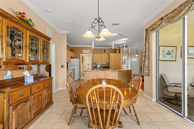 5543 NW 25th Loop, Ocala, FL 34482 - dining space featuring ornamental molding, light tile patterned flooring, and a chandelier