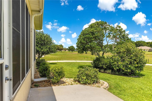 5543 NW 25th Loop, Ocala, FL 34482 - view of green lawn with a patio