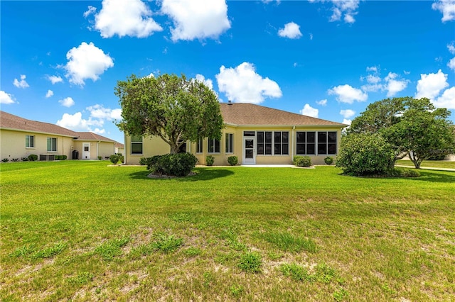 5543 NW 25th Loop, Ocala, FL 34482 - back of property with a lawn and stucco siding