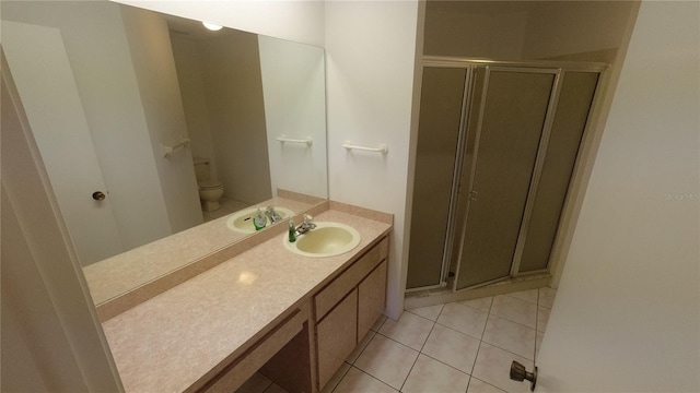 6421 Remus Dr, New Port Richey, FL 34653 - bathroom with vanity, a stall shower, and tile patterned floors
