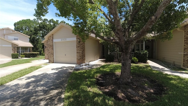 6421 Remus Dr, New Port Richey, FL 34653 - view of front of home with a garage, concrete driveway, and brick siding