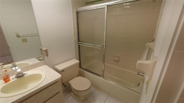 6421 Remus Dr, New Port Richey, FL 34653 - bathroom with tile patterned floors, vanity, and shower / bath combination with glass door