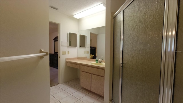6421 Remus Dr, New Port Richey, FL 34653 - bathroom featuring a shower stall, vanity, and tile patterned flooring