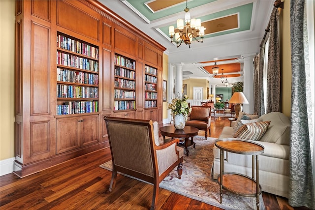 17800 SE 237th Ct, Umatilla, FL 32784 - sitting room featuring decorative columns, ornamental molding, coffered ceiling, dark wood-type flooring, and a chandelier