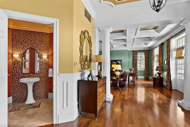 17800 SE 237th Ct, Umatilla, FL 32784 - hall featuring ornate columns, coffered ceiling, crown molding, beam ceiling, and wood finished floors