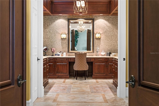 17800 SE 237th Ct, Umatilla, FL 32784 - bathroom featuring a chandelier, vanity, and inlaid floor details
