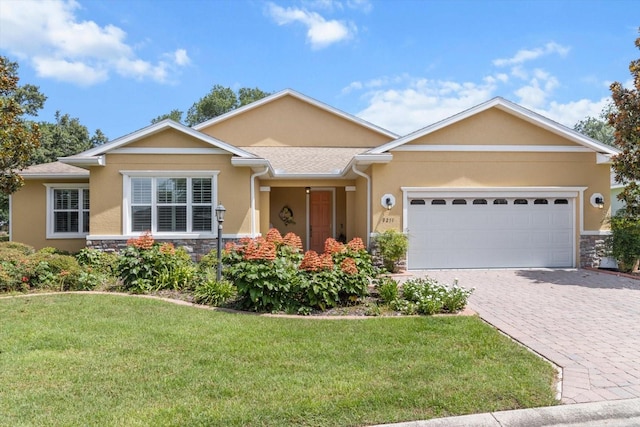 9251 SW 94th Loop, Ocala, FL 34481 - ranch-style house featuring stone siding, stucco siding, and a front yard