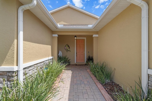 9251 SW 94th Loop, Ocala, FL 34481 - property entrance featuring stucco siding and stone siding