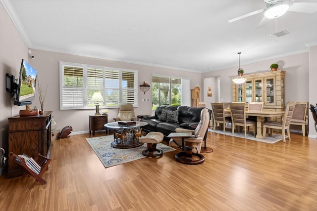 9251 SW 94th Loop, Ocala, FL 34481 - living area featuring wood finished floors, ornamental molding, and a ceiling fan