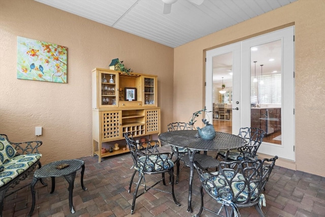 9251 SW 94th Loop, Ocala, FL 34481 - dining area featuring a ceiling fan, brick floors, and a textured wall