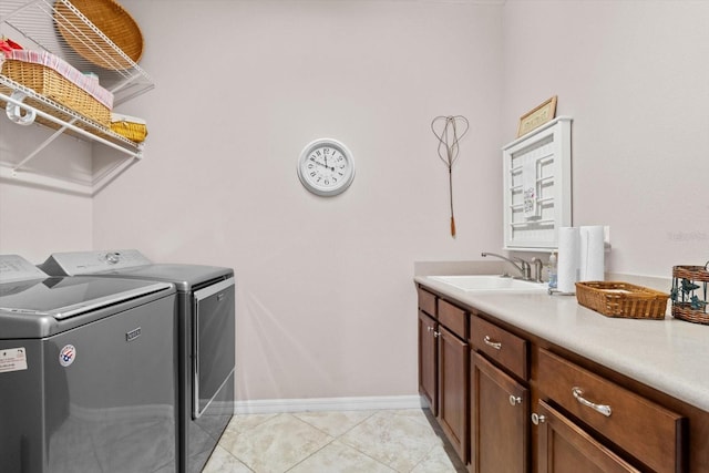 9251 SW 94th Loop, Ocala, FL 34481 - washroom featuring washer and dryer, cabinet space, and light tile patterned floors