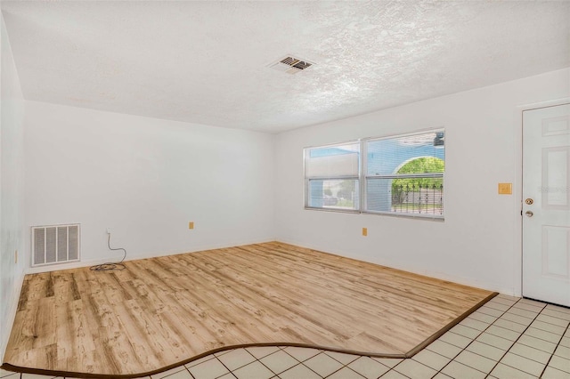 231 S Barbour St, Beverly Hills, FL 34465 - empty room with a textured ceiling and light wood-style floors